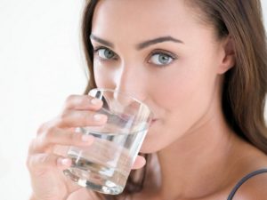 Girl drinking pure hydration water